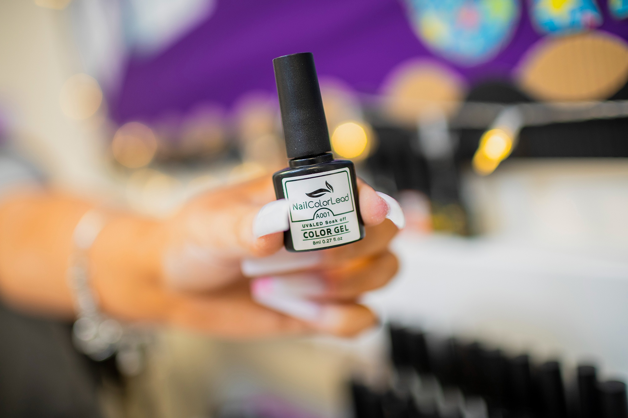 Image of hand holding nail gel
