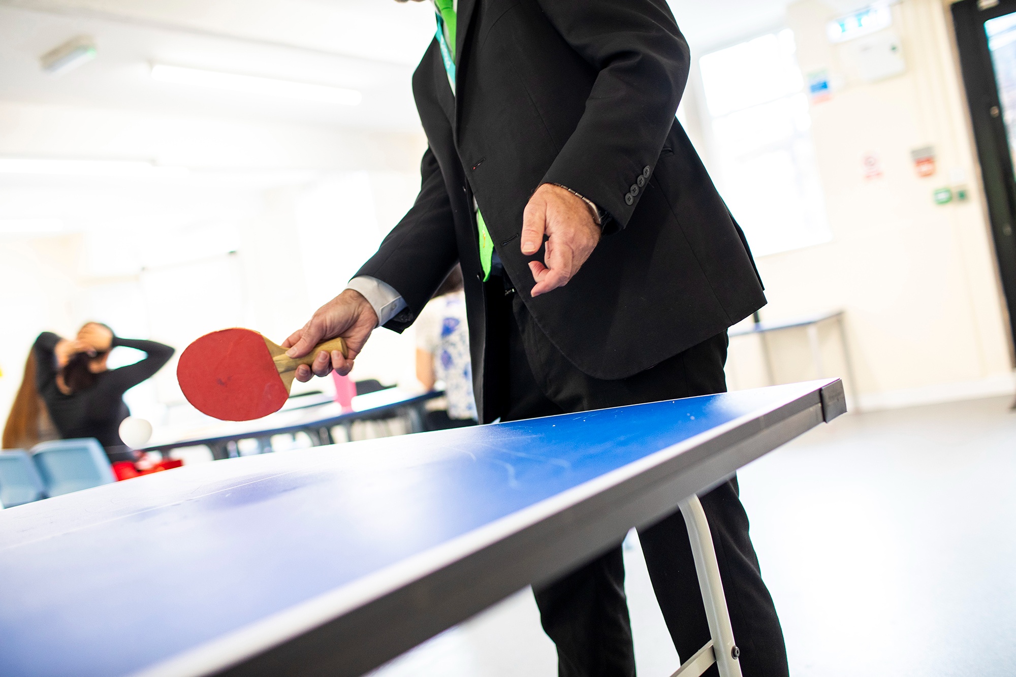 Image of man playing table tennis